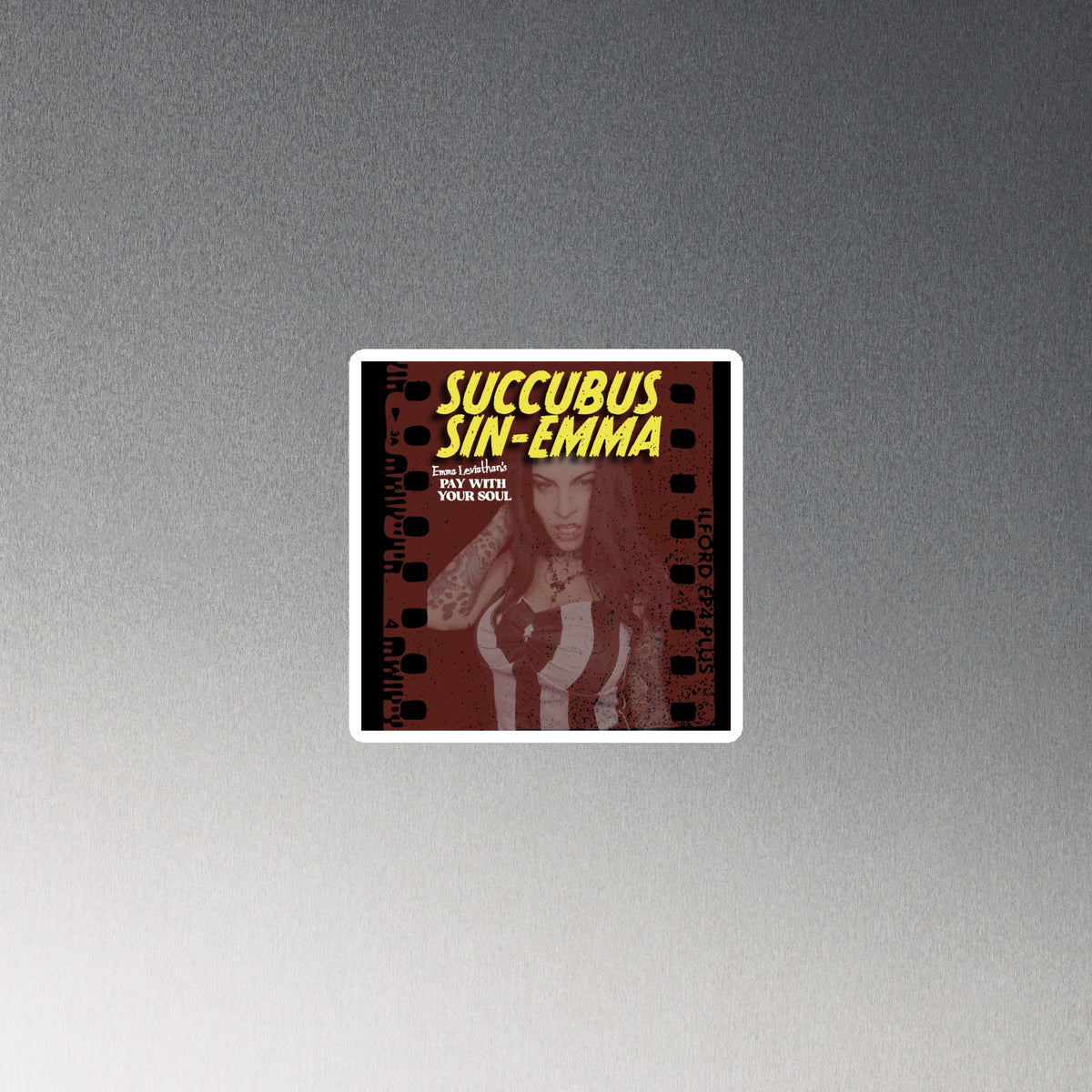Succubus Sin-Emma Magnet with a vintage horror poster design, dark red and black print, neon yellow lettering, and white border.