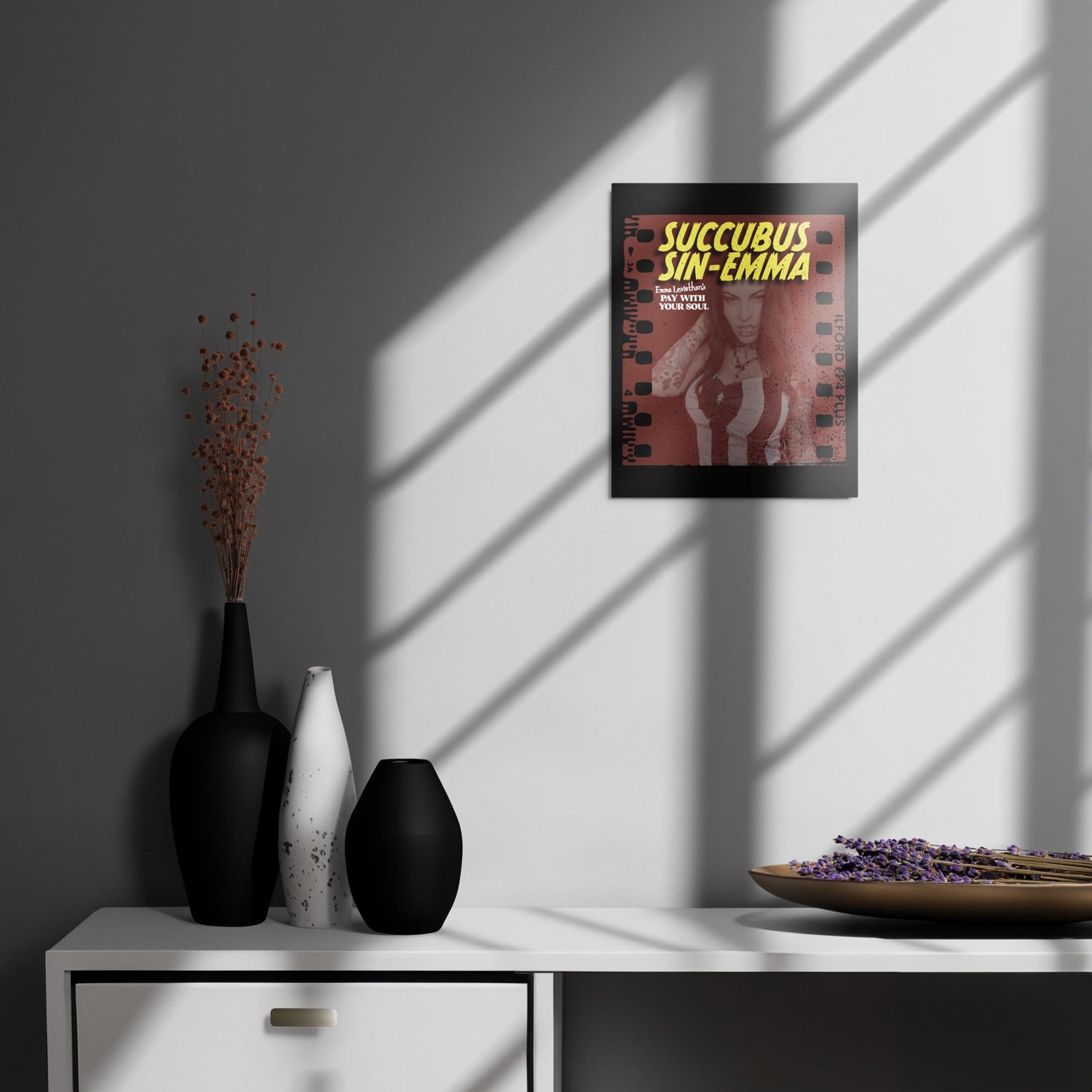 Succubus Sin-Emma metal print on gray wall, featuring devilish Emma Leviathan art with sleek aluminum shine and MDF wood frame.